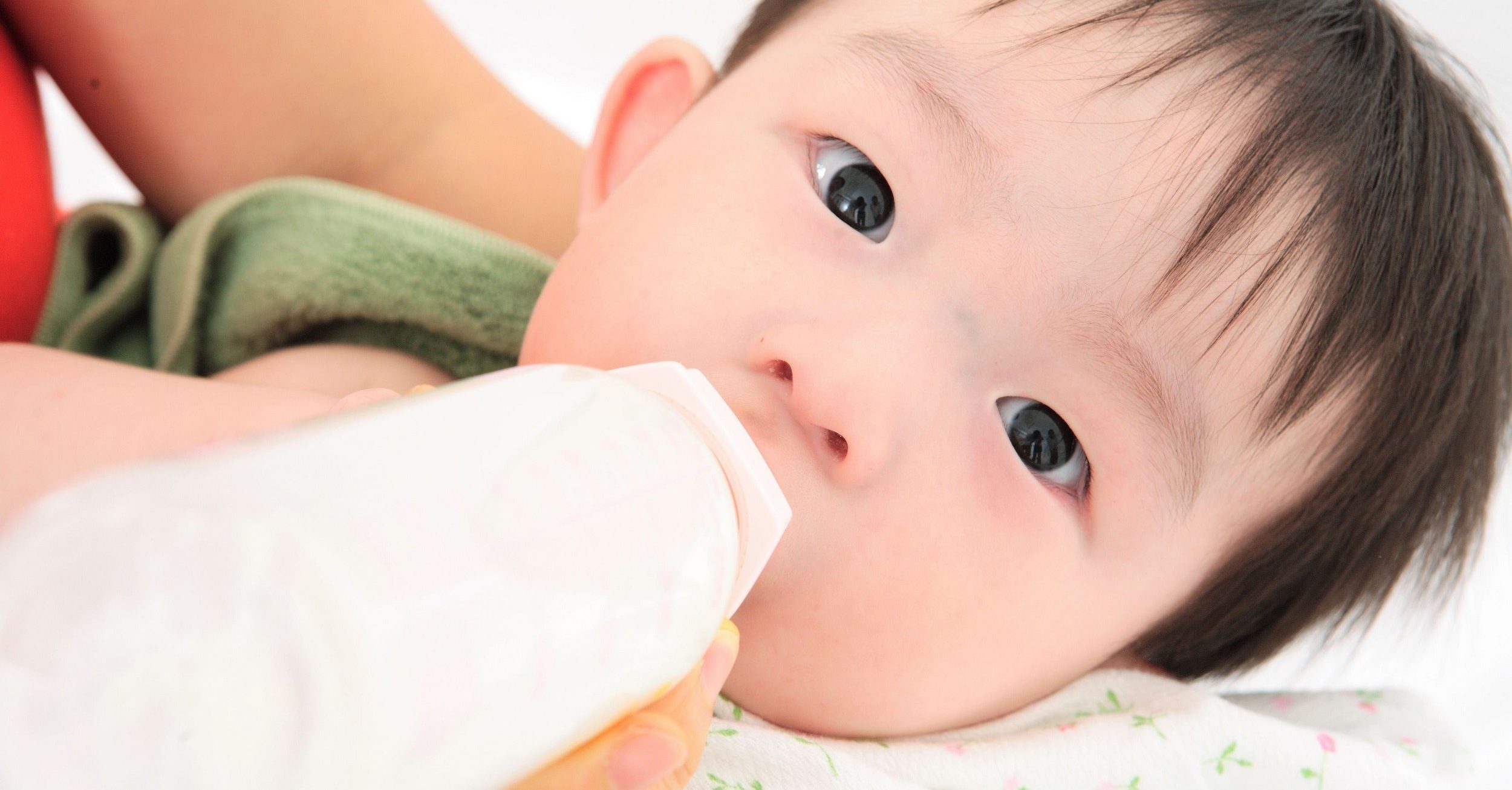 Lovely Baby drinking milk from bottle