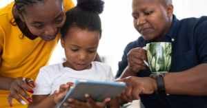 family looking at a tablet