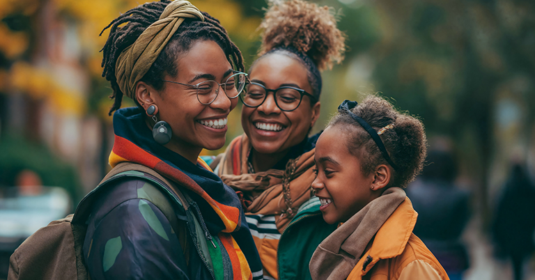 two-mom family with childoutside in the fall