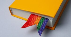 Yellow book with a rainbow bookmark