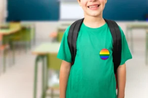 A student wearing a pride sticker in the classroom