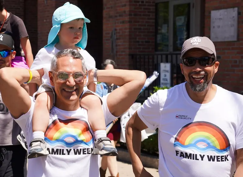 Dads and child at Family Pride Parade during Family Week 2026